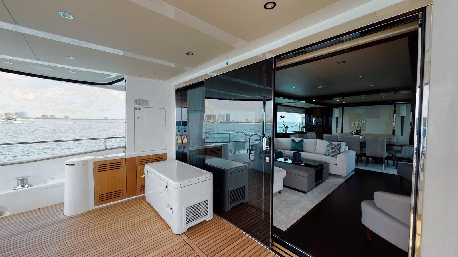a room with a couch and a table aboard PV 95 Yacht for Sale