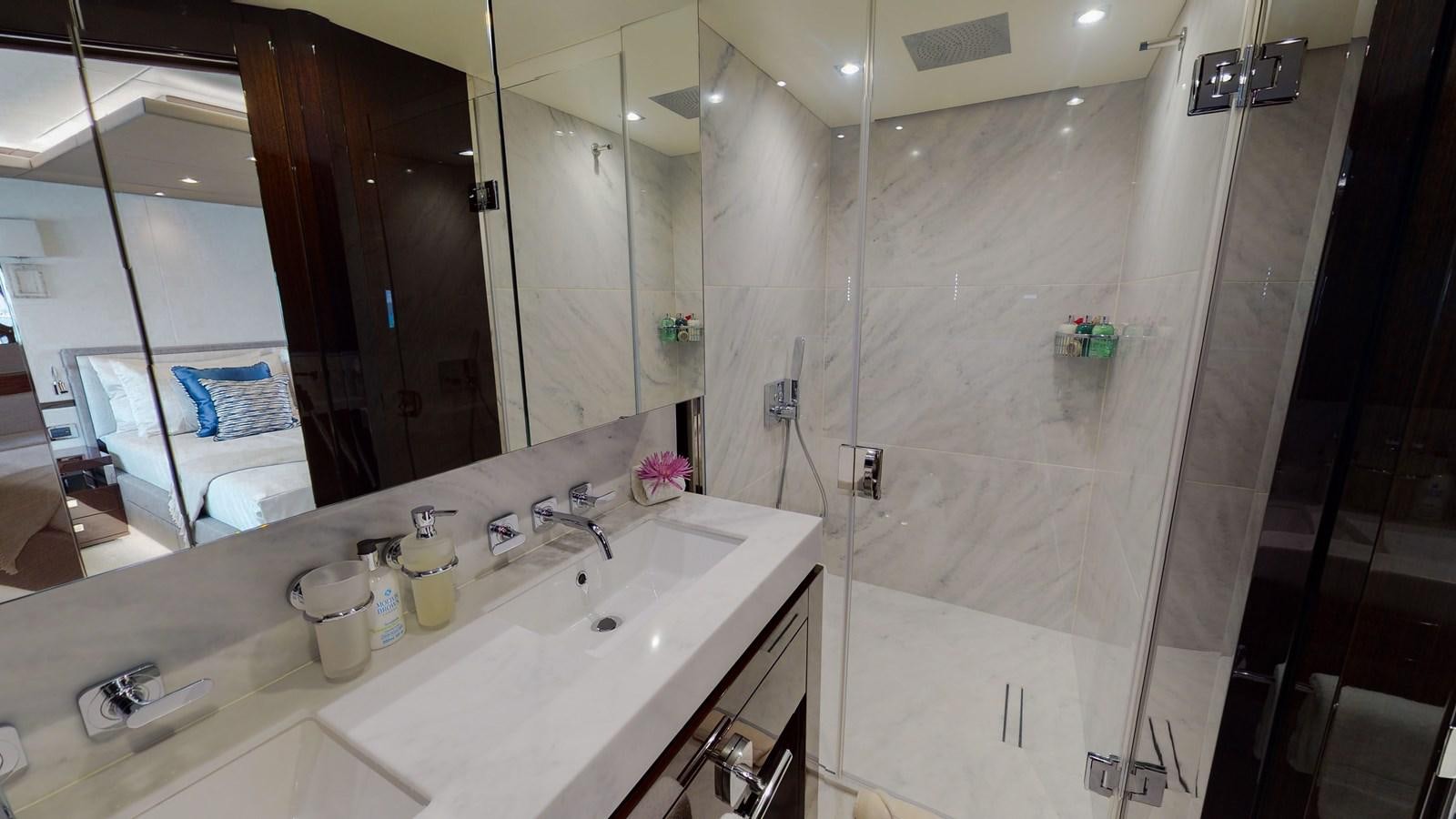 a bathroom with a large mirror aboard PV 95 Yacht for Sale