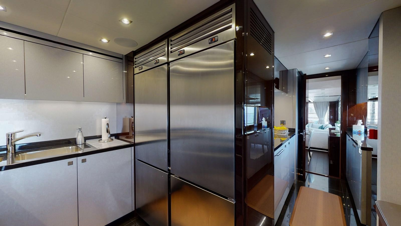 a kitchen with a glass shower aboard PV 95 Yacht for Sale