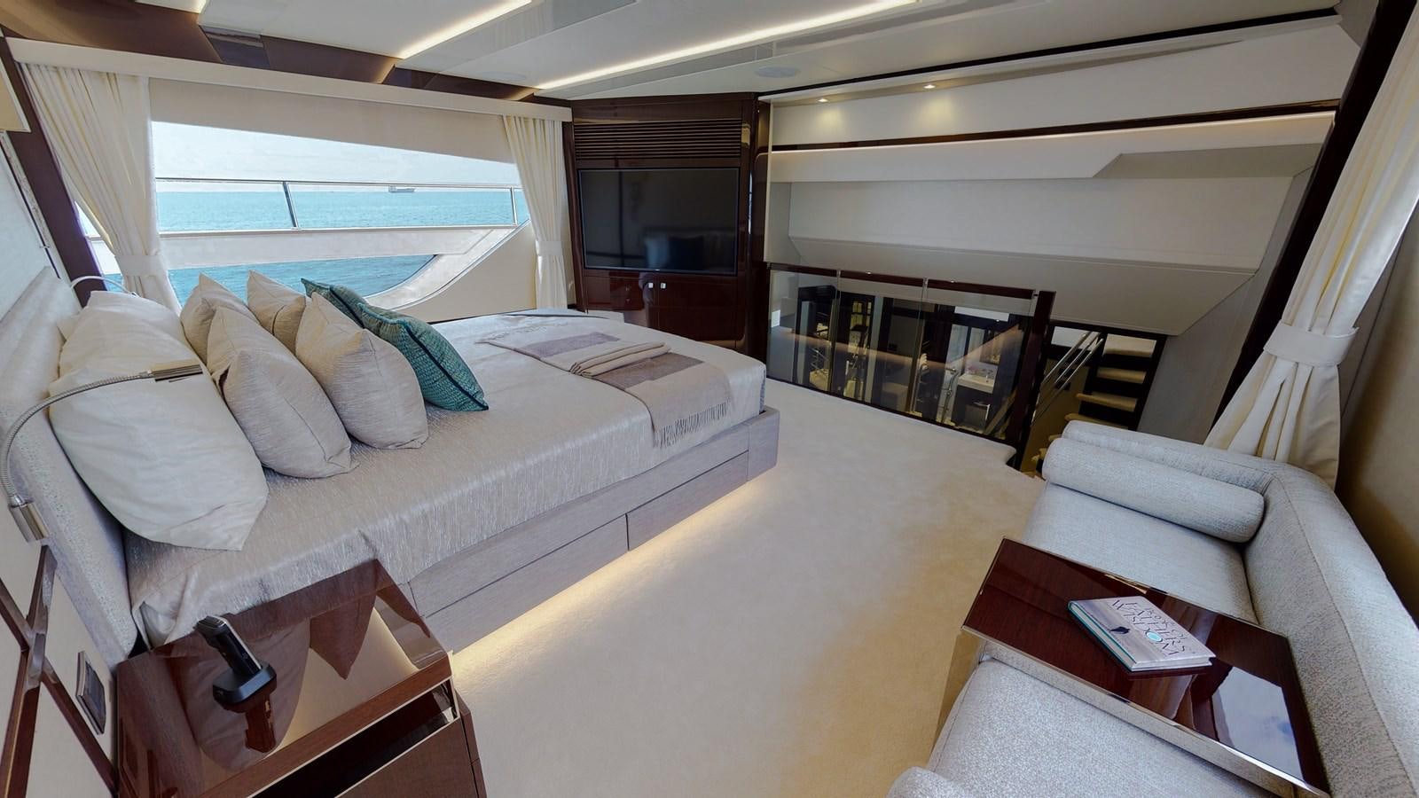 a room with a bed and a table aboard PV 95 Yacht for Sale