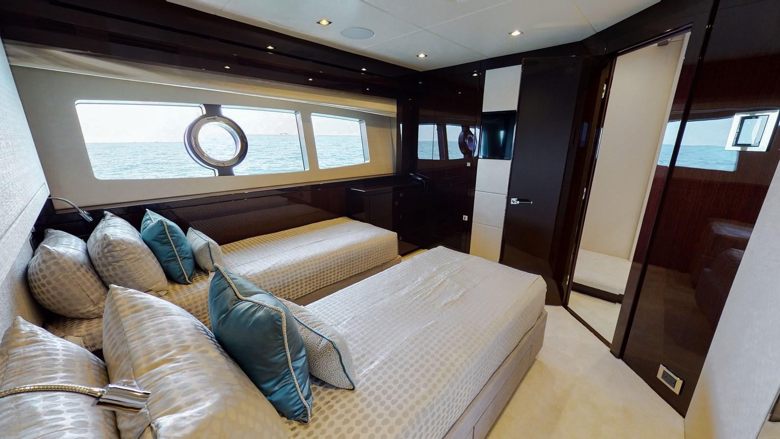 a room with a couch and a window aboard PV 95 Yacht for Sale