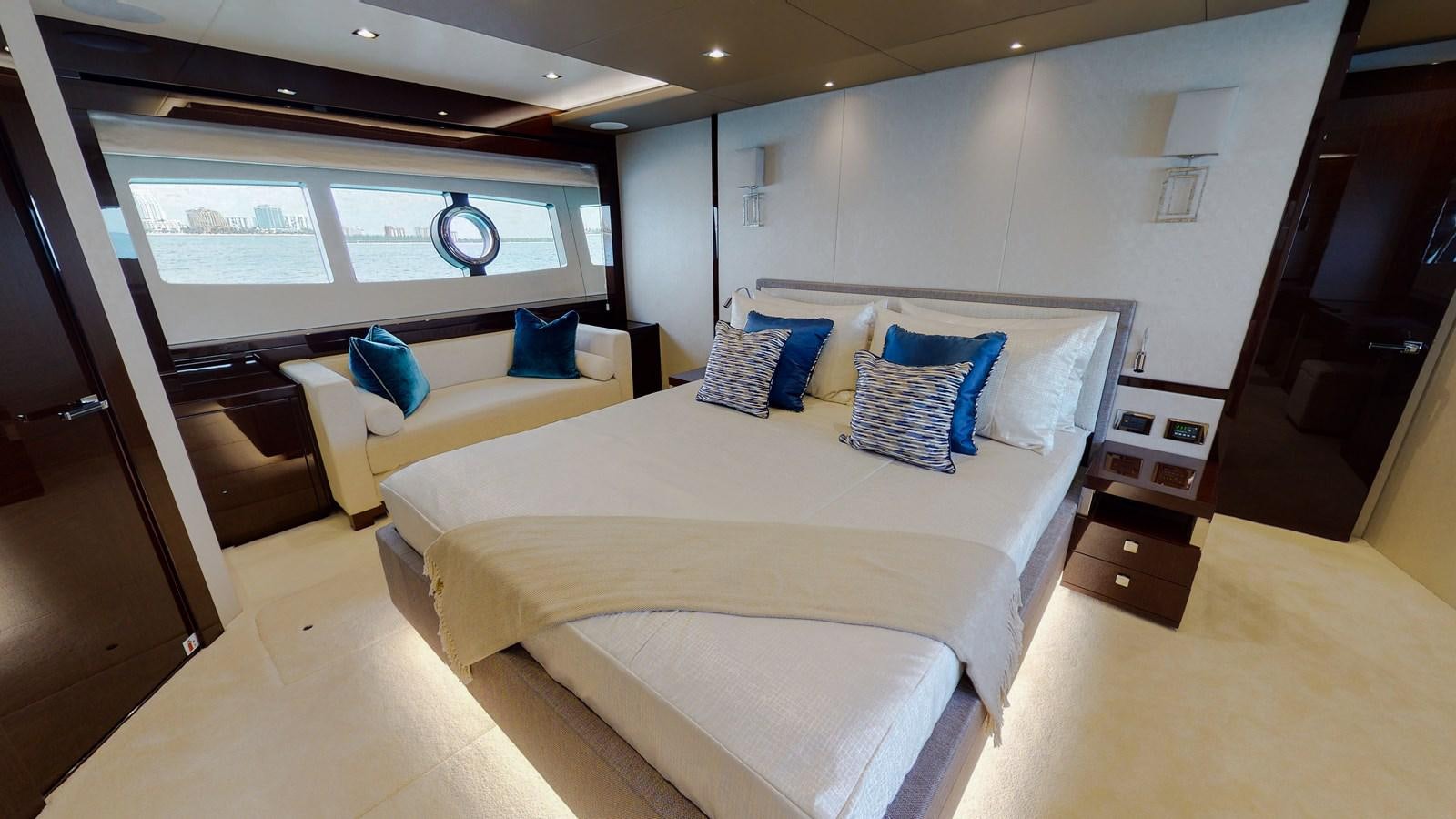 a room with a bed and a desk aboard PV 95 Yacht for Sale