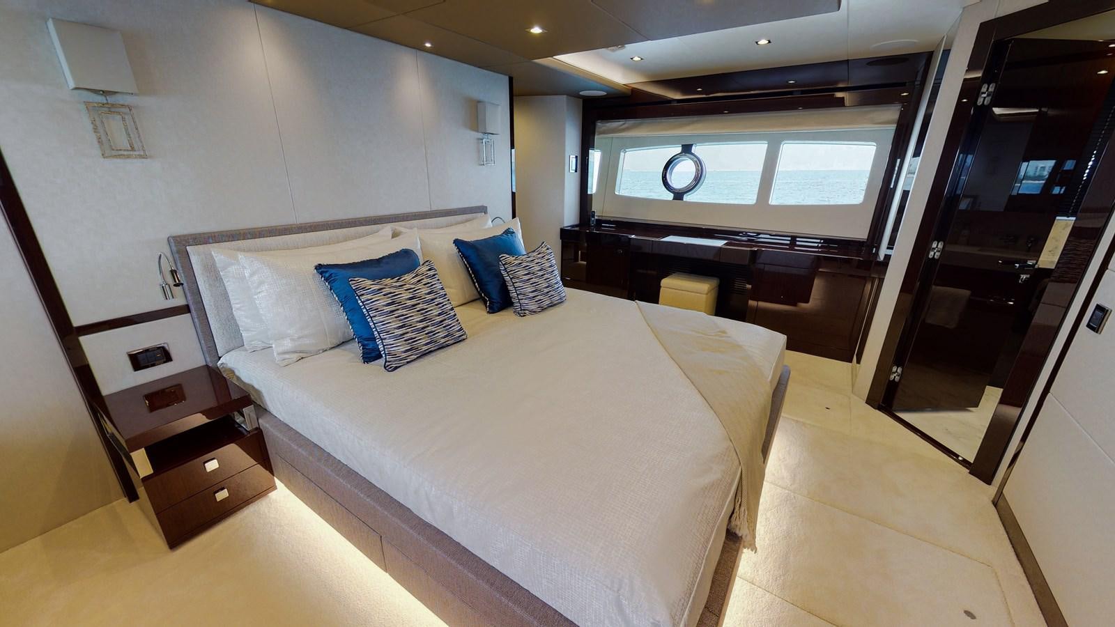 a large bedroom with a large bed aboard PV 95 Yacht for Sale
