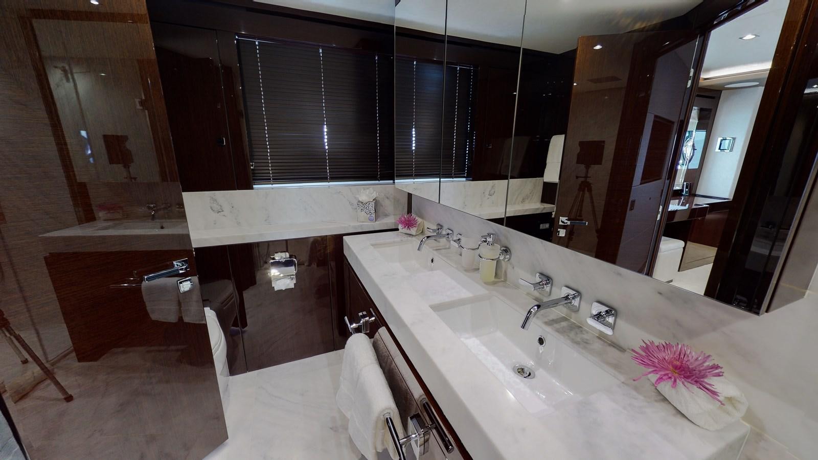 a bathroom with a bathtub sink and a mirror aboard PV 95 Yacht for Sale