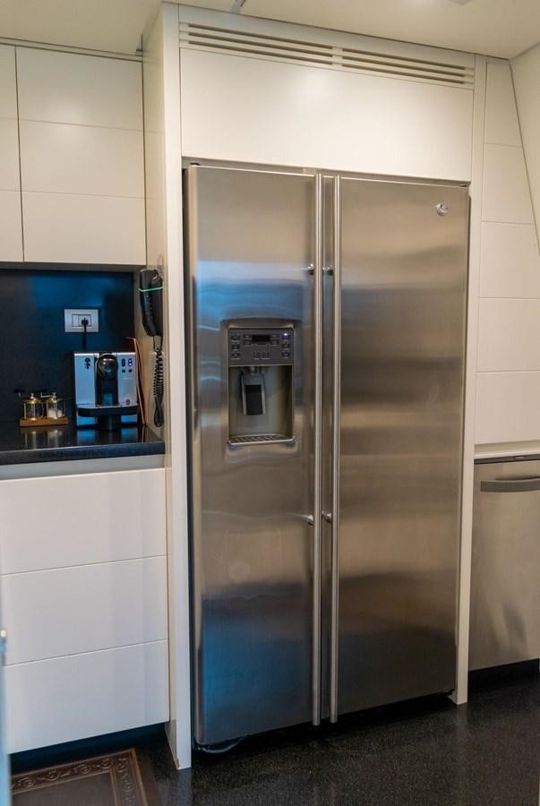 a silver refrigerator in a kitchen aboard VITA XL Yacht for Sale