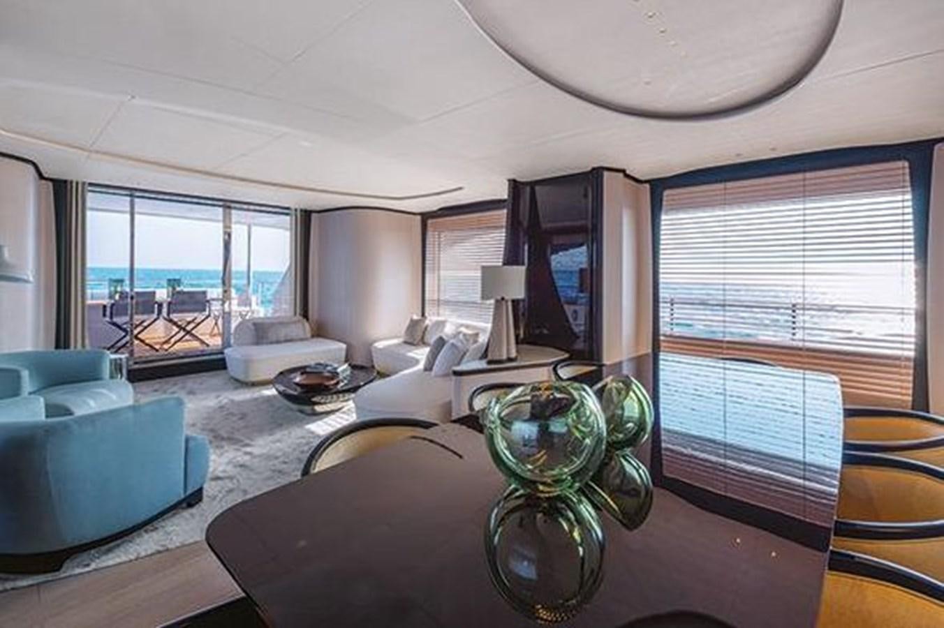 a living room with a large window aboard 2020 BENETTI DELFINO 95 Yacht for Sale