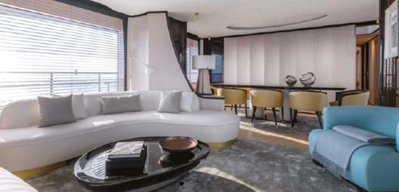 a living room with a couch and a coffee table aboard 2020 BENETTI DELFINO 95 Yacht for Sale