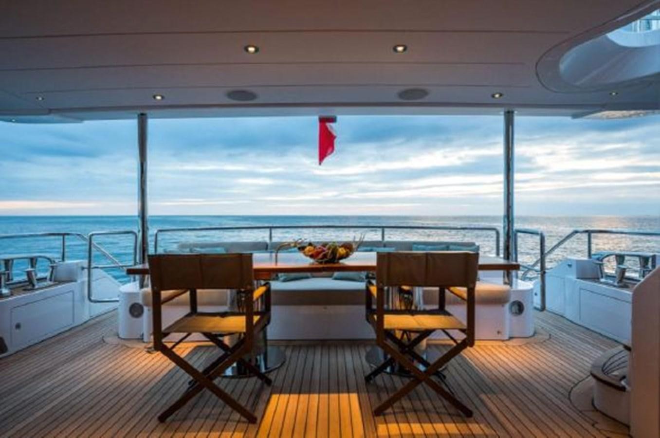 a room with a table and chairs aboard 2020 BENETTI DELFINO 95 Yacht for Sale