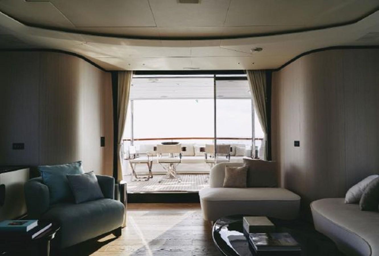 a living room with a large window aboard 2020 BENETTI DELFINO 95 Yacht for Sale