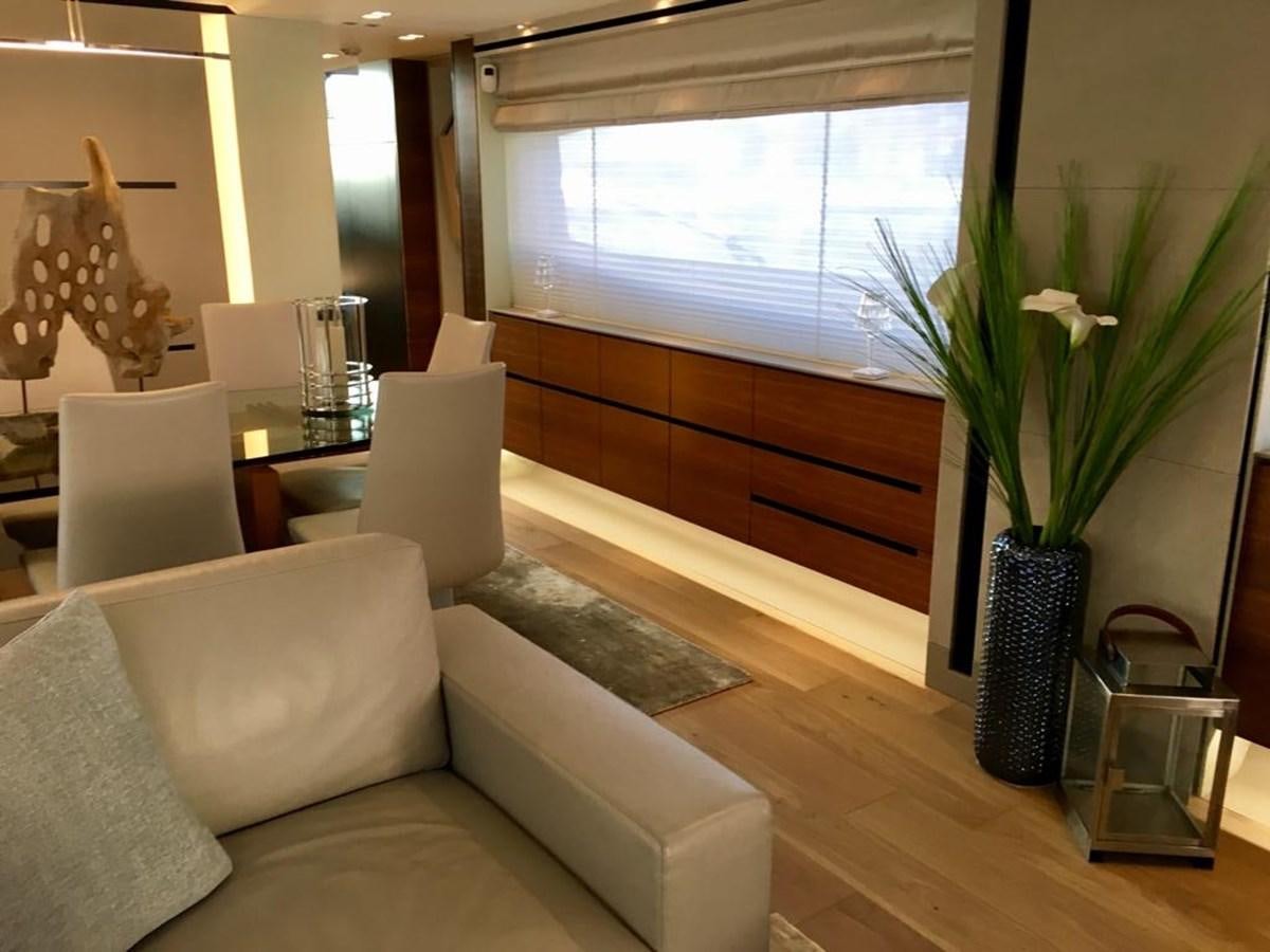 a living room with a vase of flowers and a couch aboard KEROS ISLAND Yacht for Sale