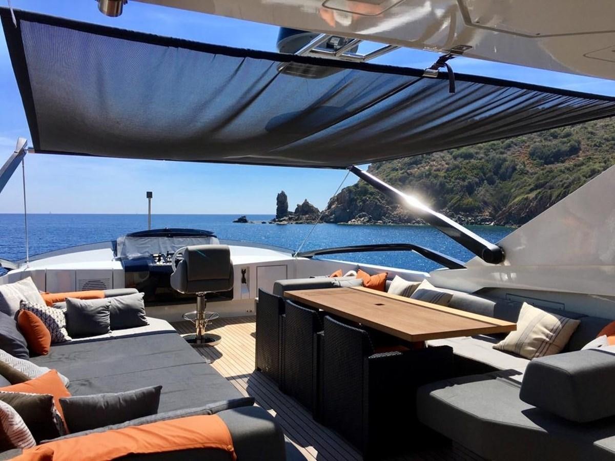 a room with a view of the ocean and a large ship aboard KEROS ISLAND Yacht for Sale