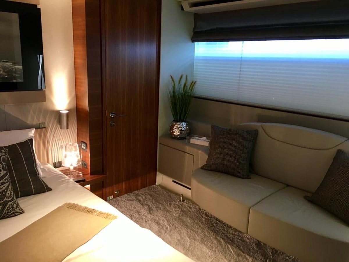 a room with a bed and a couch aboard KEROS ISLAND Yacht for Sale