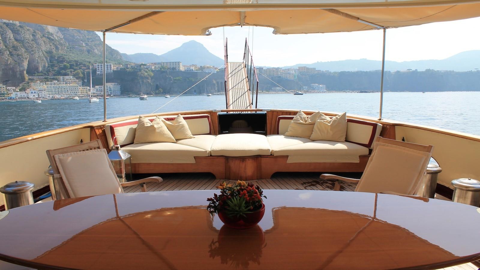 a large sofa with a flower pot on it aboard DP MONITOR Yacht for Sale