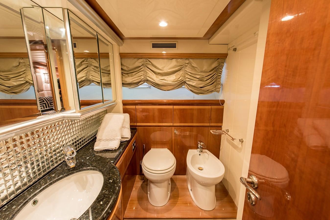 a bathroom with a large mirror aboard 00Z Yacht for Sale