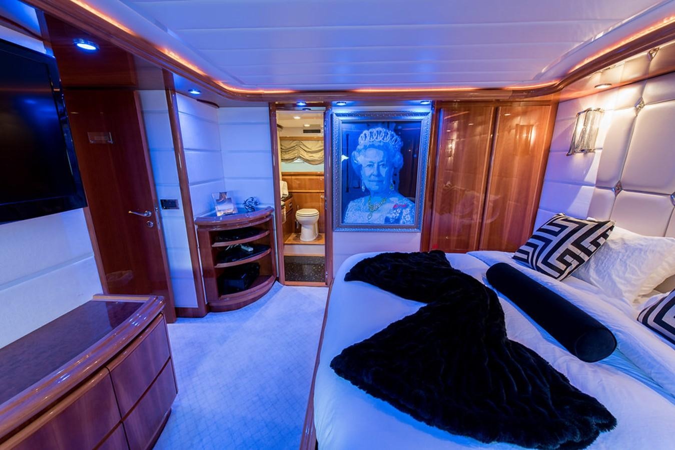 a bedroom with a large mirror aboard 00Z Yacht for Sale
