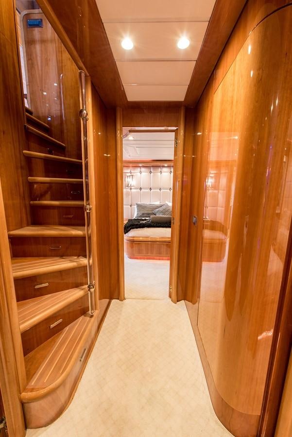 a hallway with a bed and a closet aboard 00Z Yacht for Sale