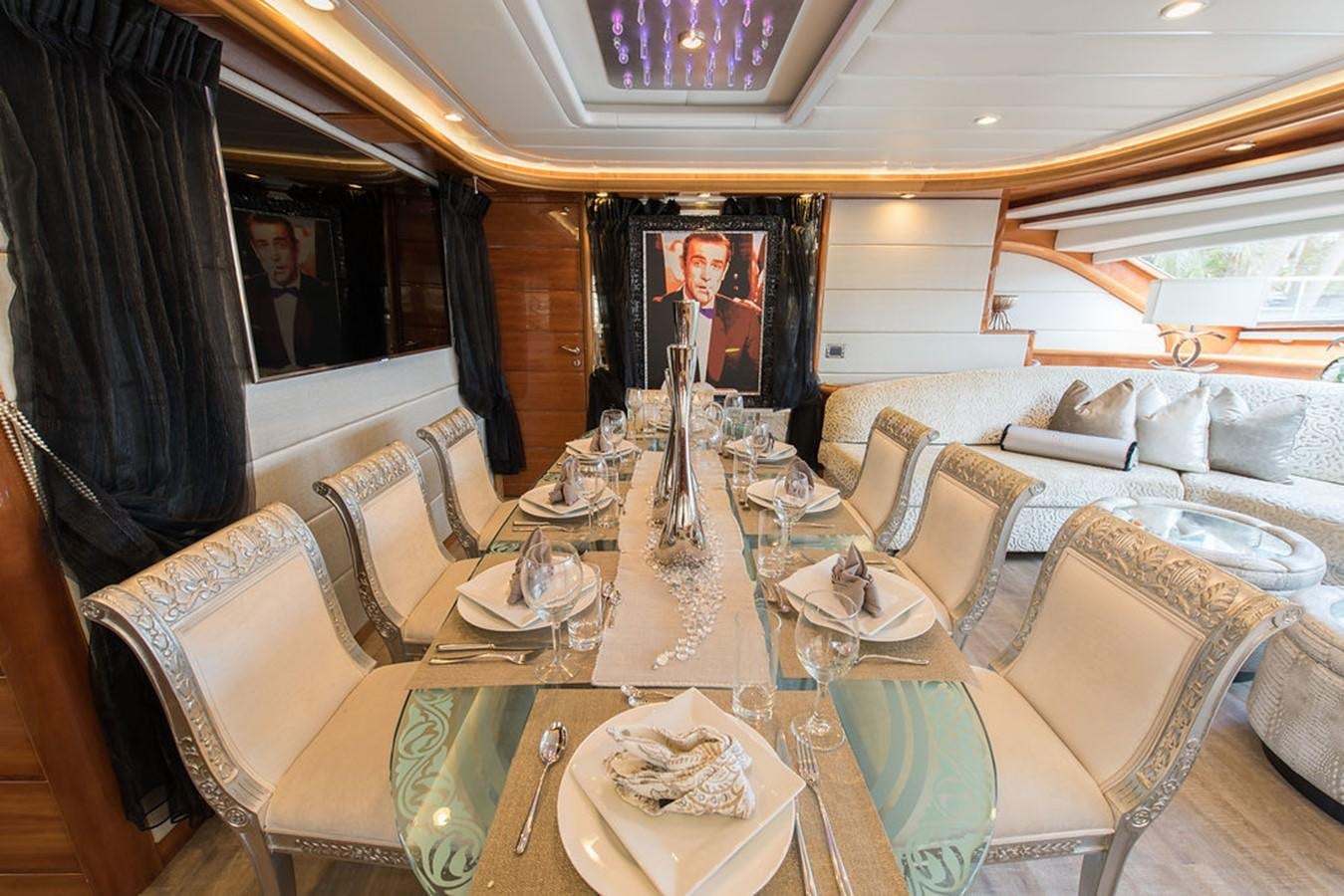 a dining room with a table set aboard 00Z Yacht for Sale