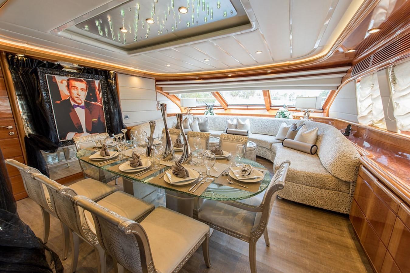 a dining room with a table and chairs aboard 00Z Yacht for Sale