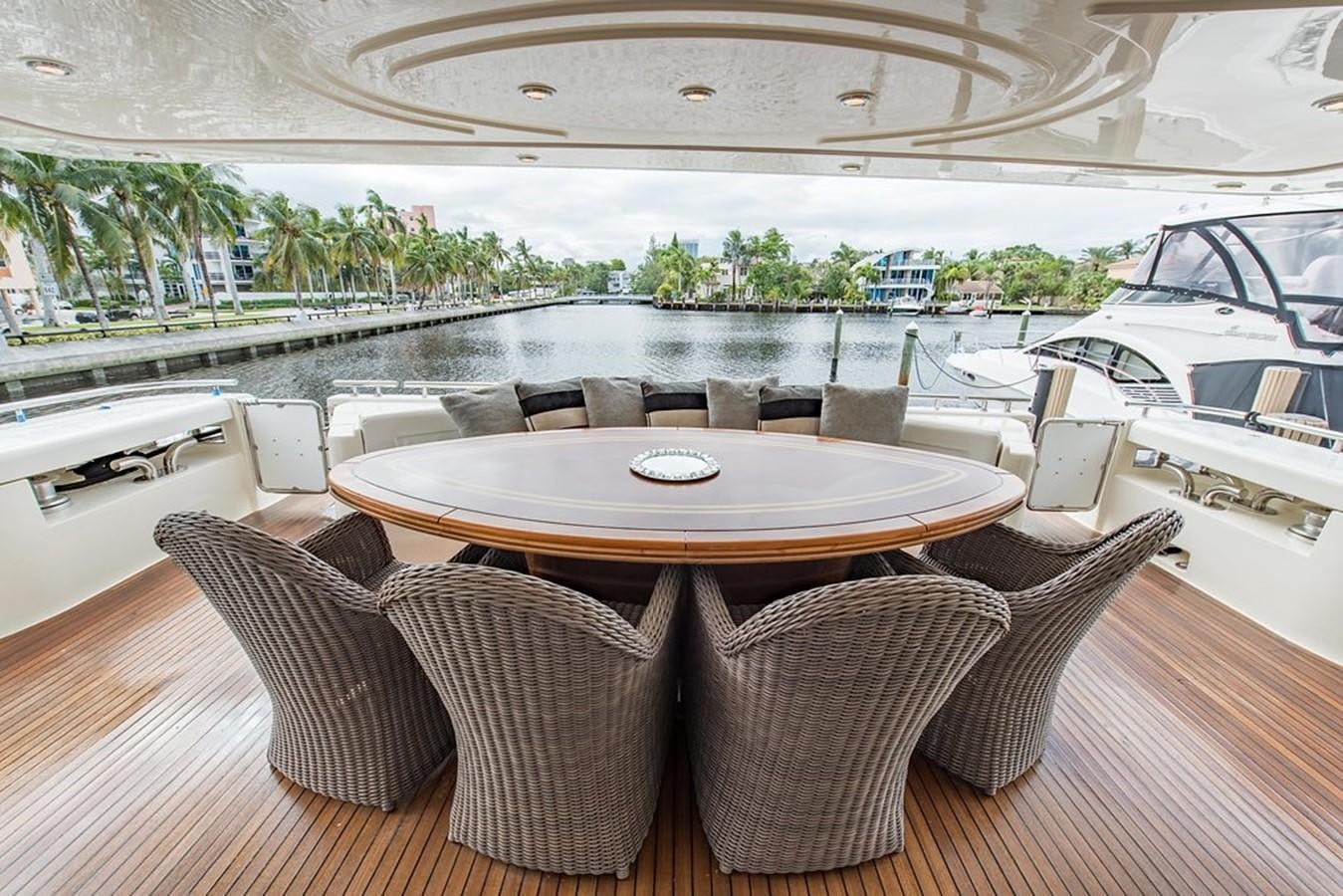 a room with a table and chairs aboard 00Z Yacht for Sale