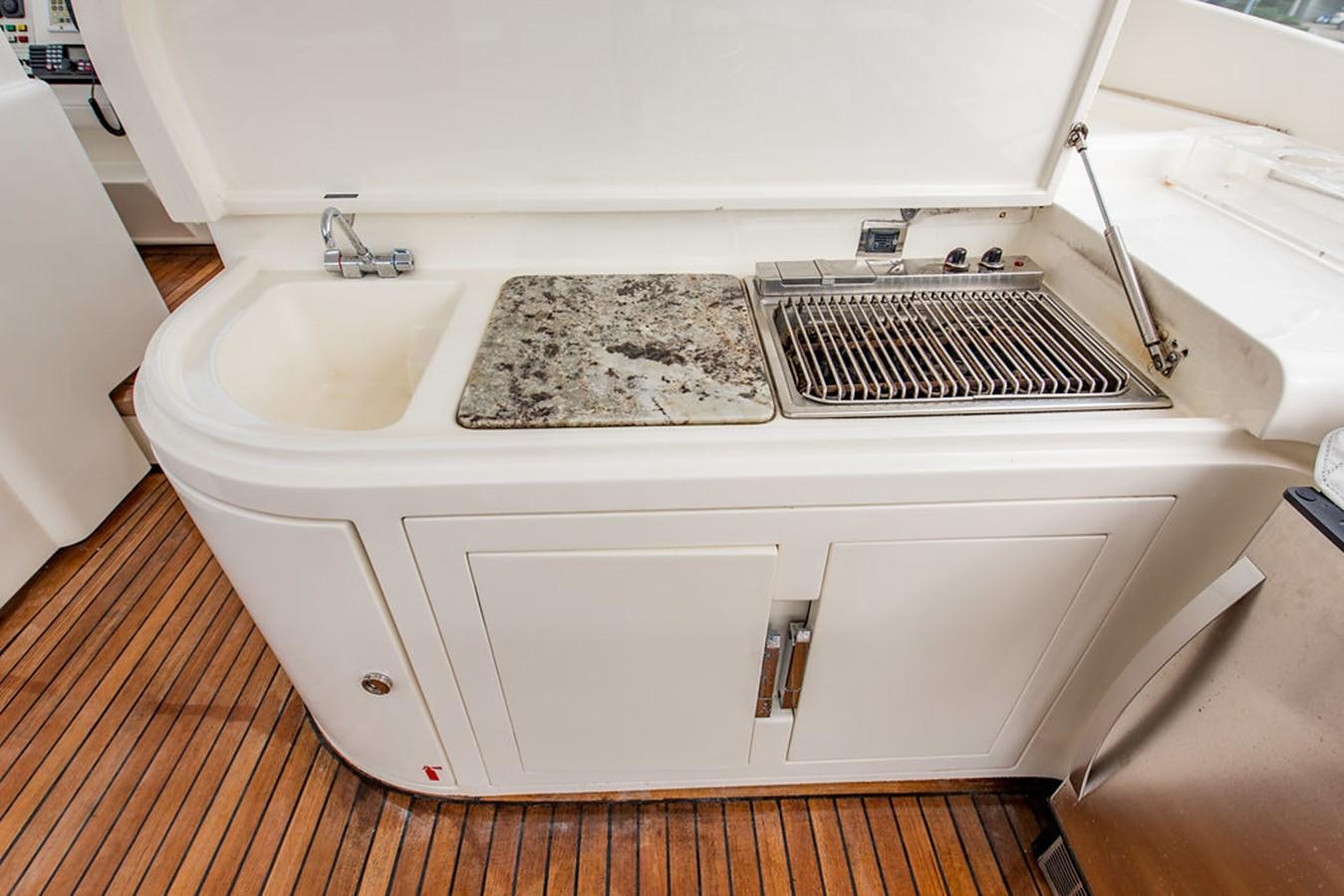 a white bathtub with a tile floor and a rug on the floor aboard 00Z Yacht for Sale