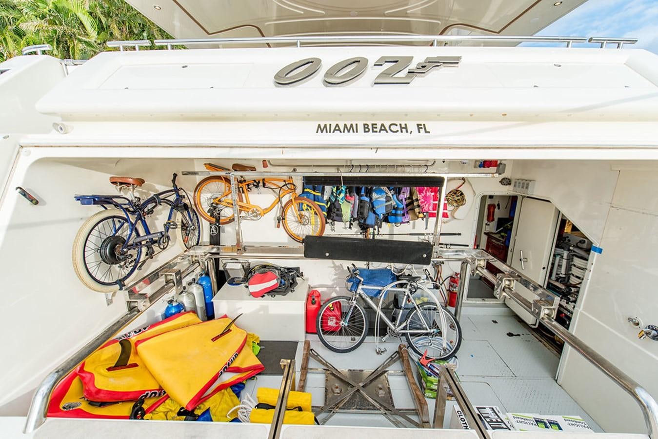 a white trailer with bicycles and a rack of bikes on it aboard 00Z Yacht for Sale