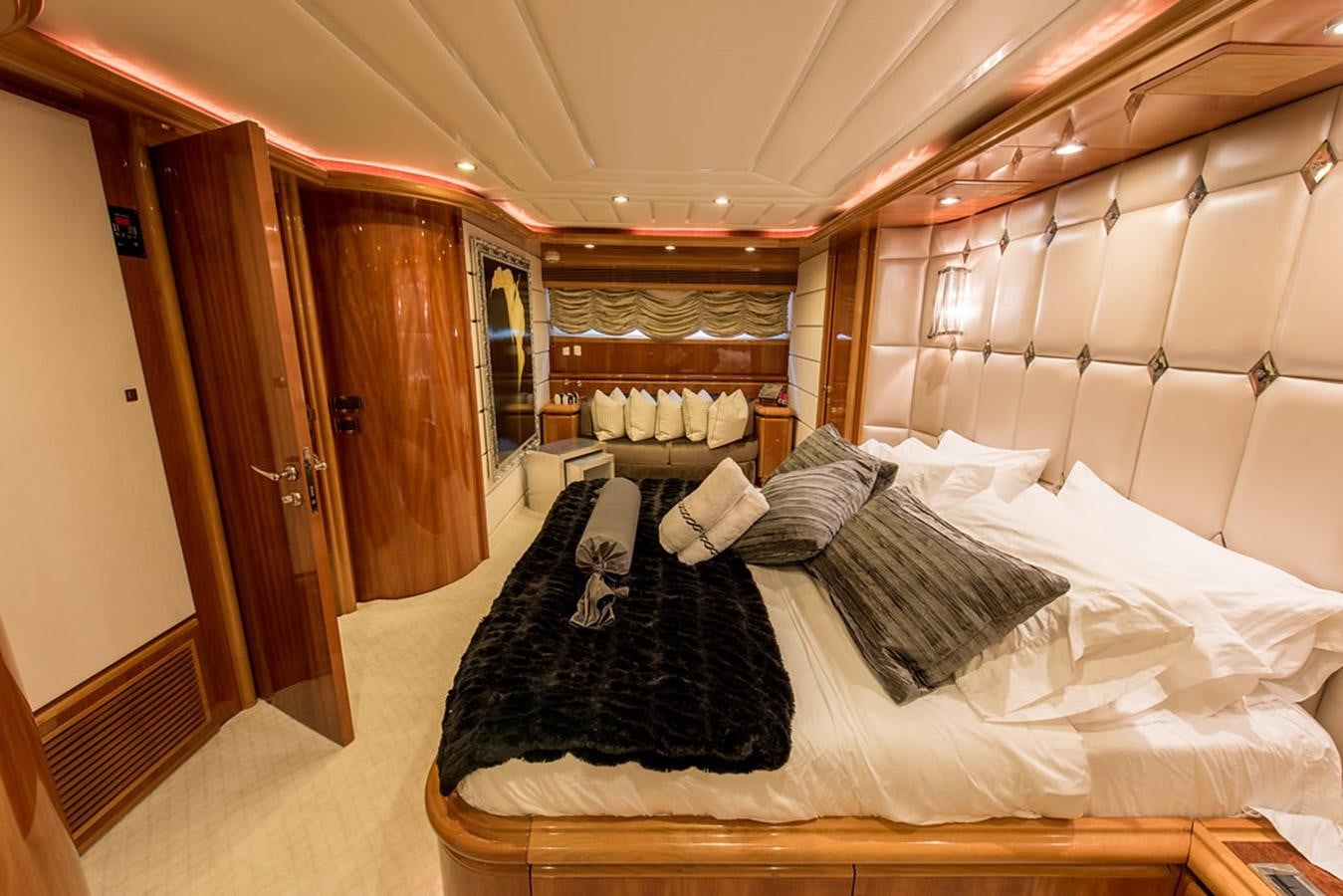 a room with a bed and a closet aboard 00Z Yacht for Sale