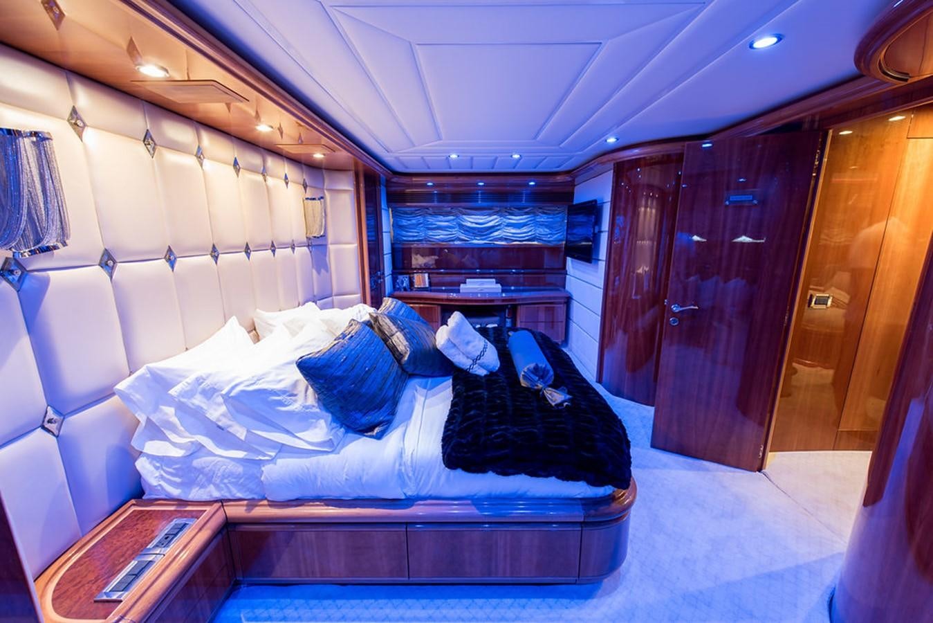 a bed in a room aboard 00Z Yacht for Sale