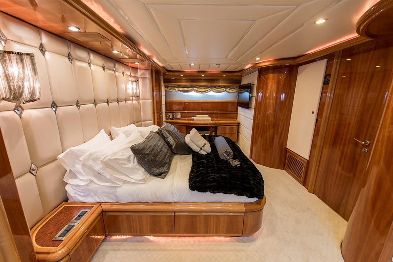 a bed with white sheets aboard 00Z Yacht for Sale