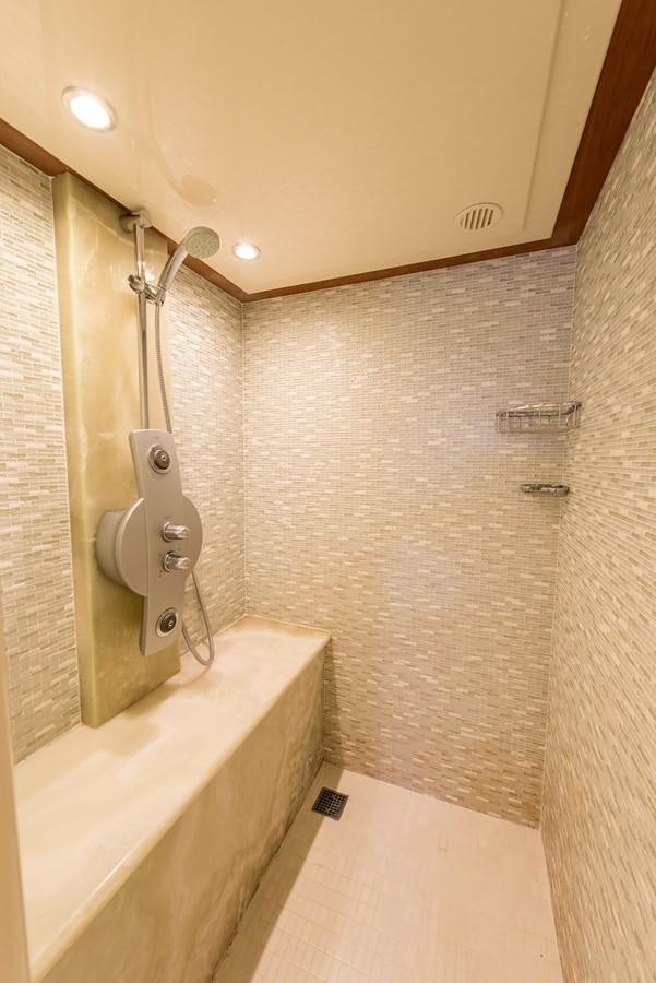 a bathroom with a shower and a toilet aboard 00Z Yacht for Sale