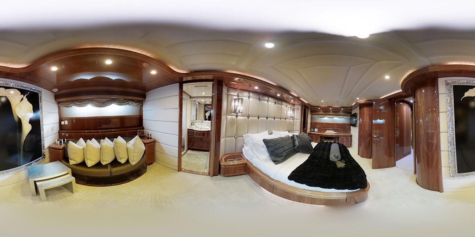 a room with a bed and a mirror aboard 00Z Yacht for Sale