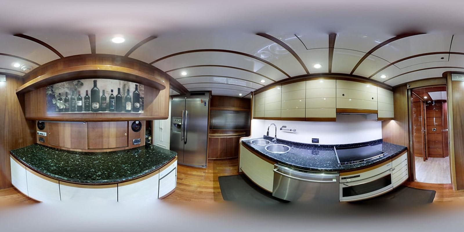 a large kitchen with a large marble counter top aboard 00Z Yacht for Sale