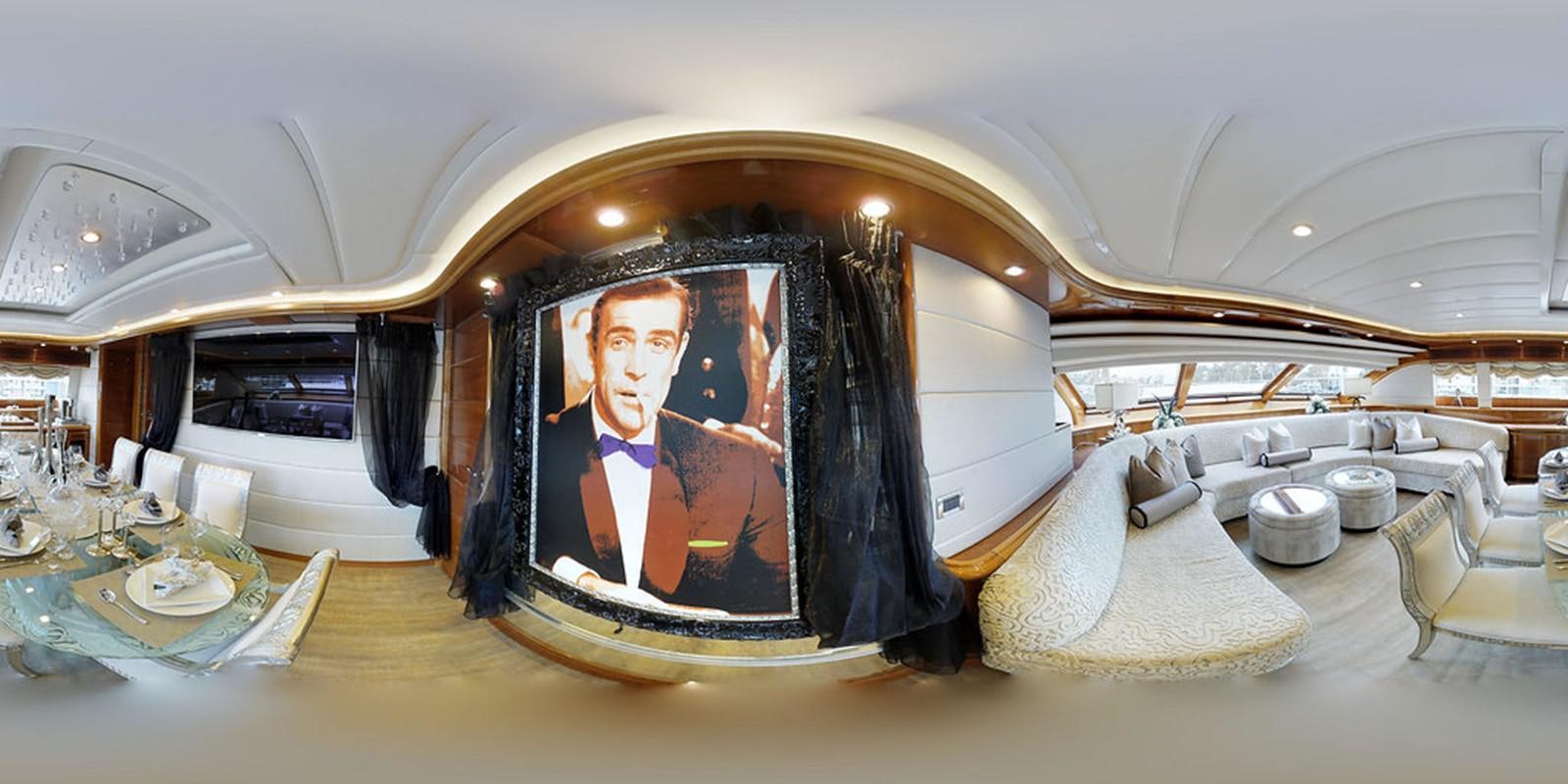 a large room with a painting on the wall aboard 00Z Yacht for Sale