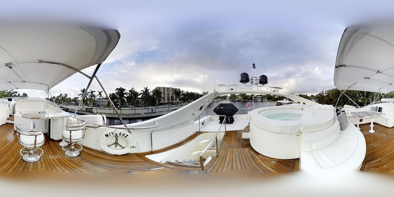 a large white boat with a large white boat in the water aboard 00Z Yacht for Sale