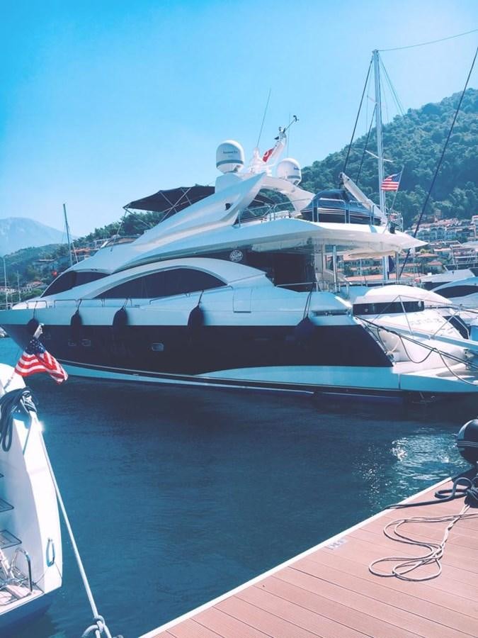 a large boat with a flag on it aboard FUNTASEA Yacht for Sale