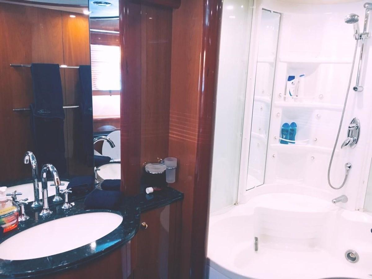 a bathroom with a sink and a bathtub aboard FUNTASEA Yacht for Sale
