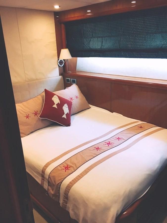 a bed with pillows on it aboard FUNTASEA Yacht for Sale