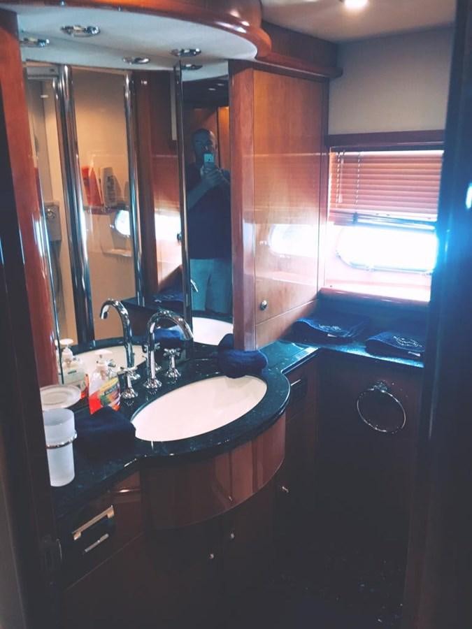 a bathroom with a large mirror aboard FUNTASEA Yacht for Sale