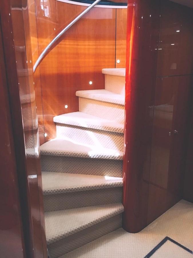 a staircase with a red railing aboard FUNTASEA Yacht for Sale