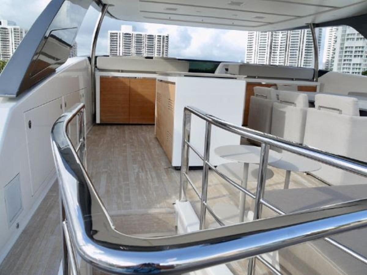 a balcony with chairs and tables aboard ASTONISH Yacht for Sale