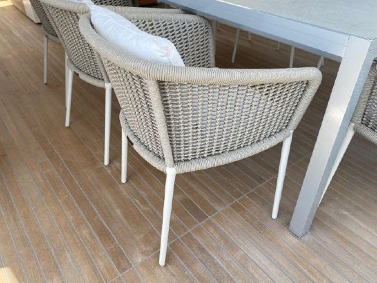 a white chair with a white cushion aboard ASTONISH Yacht for Sale