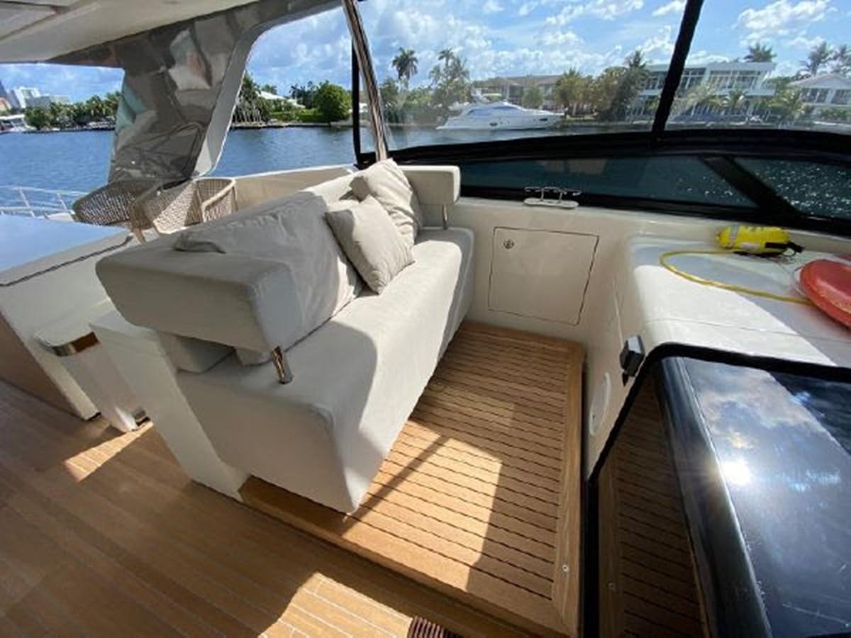 a room with a couch and a window aboard ASTONISH Yacht for Sale