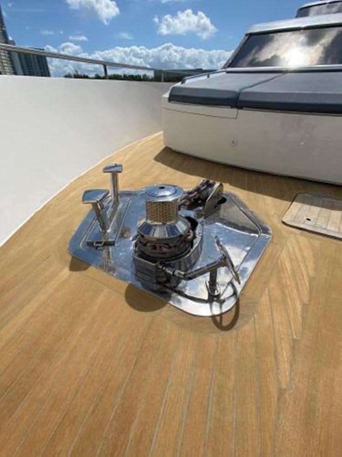 a car with a motorcycle on the front aboard ASTONISH Yacht for Sale