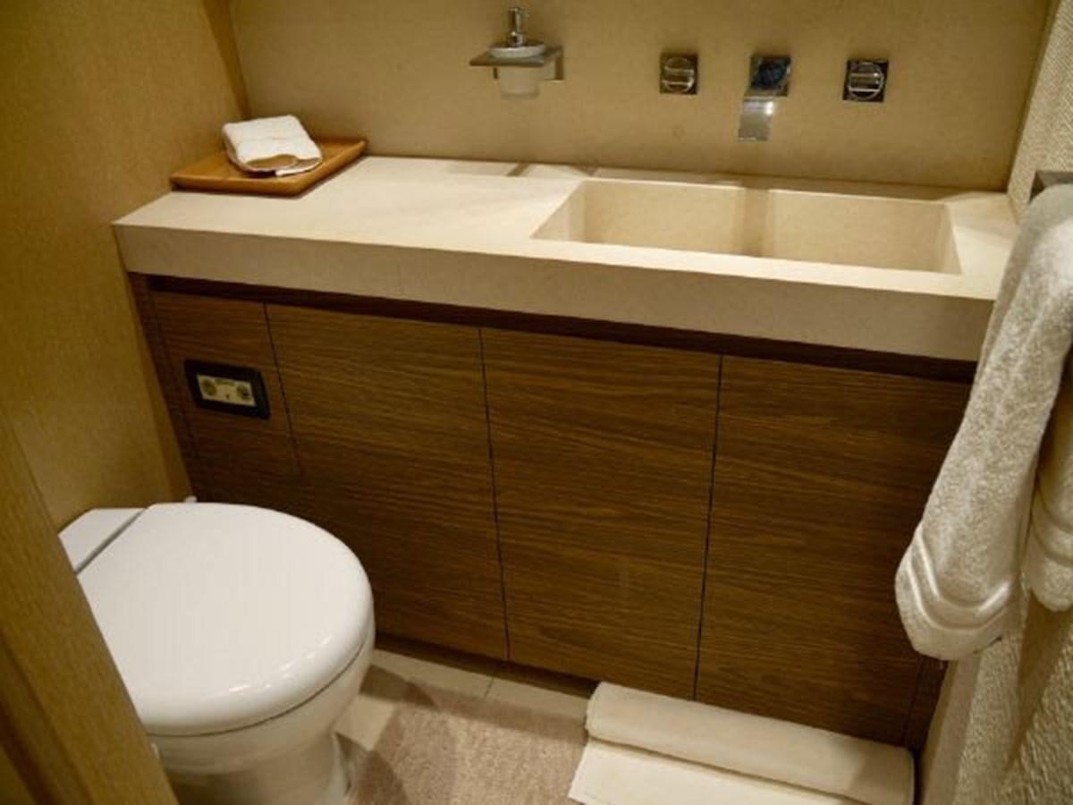 a bathroom with a sink and toilet aboard ASTONISH Yacht for Sale