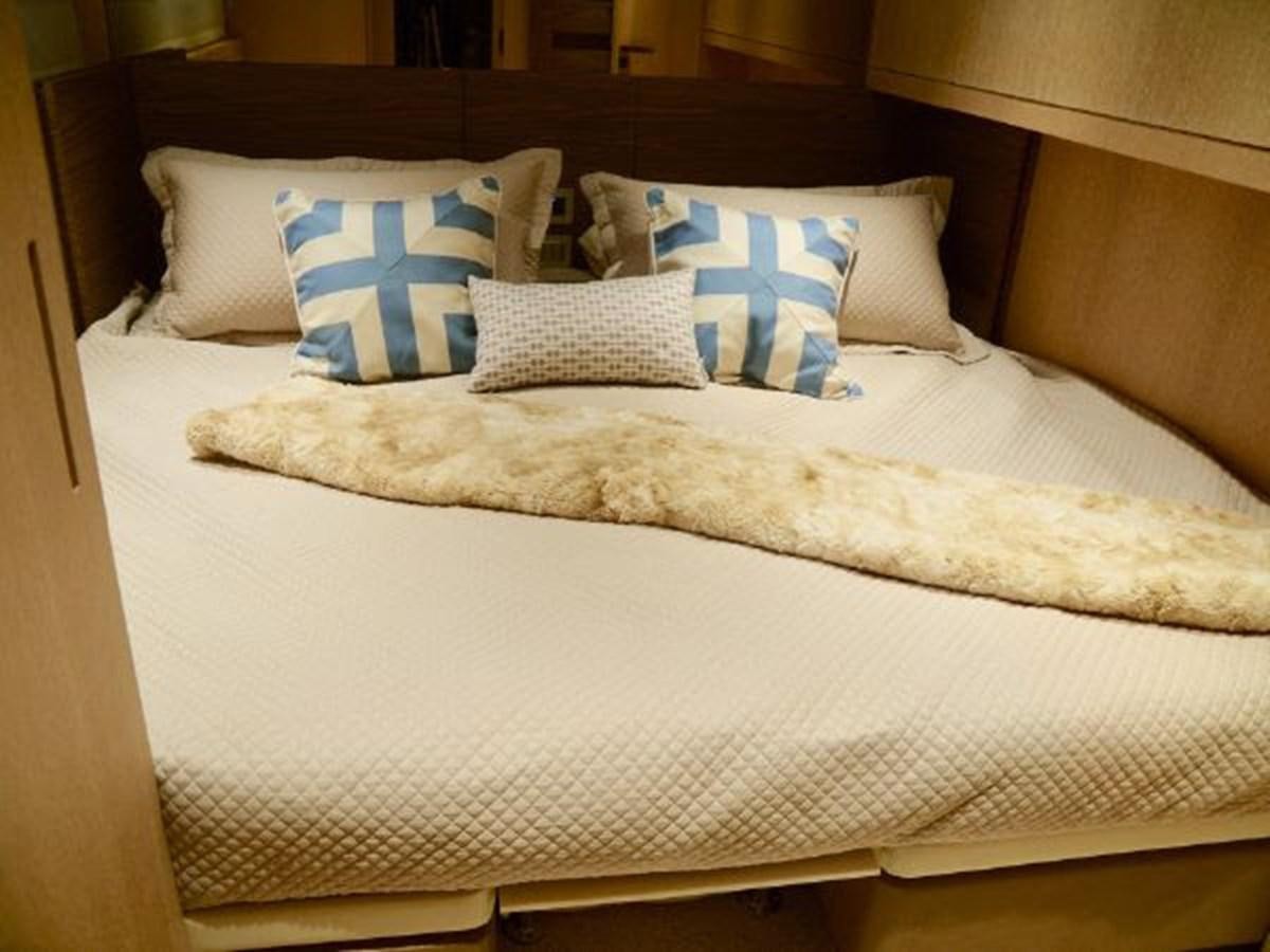 a bed with pillows aboard ASTONISH Yacht for Sale