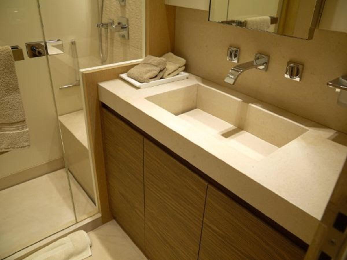 a bathroom with a sink and a mirror aboard ASTONISH Yacht for Sale