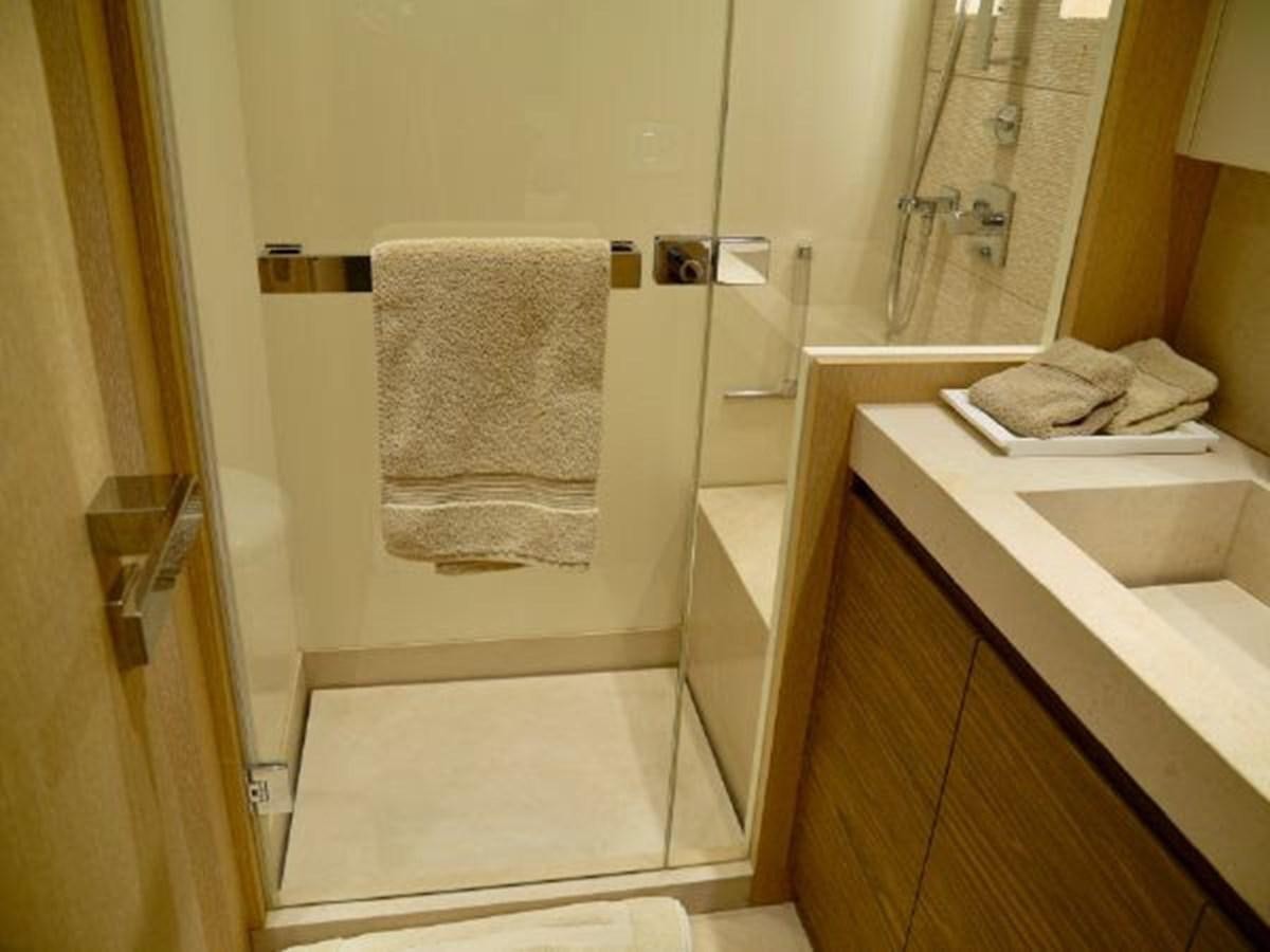 a bathroom with a sink and towels aboard ASTONISH Yacht for Sale