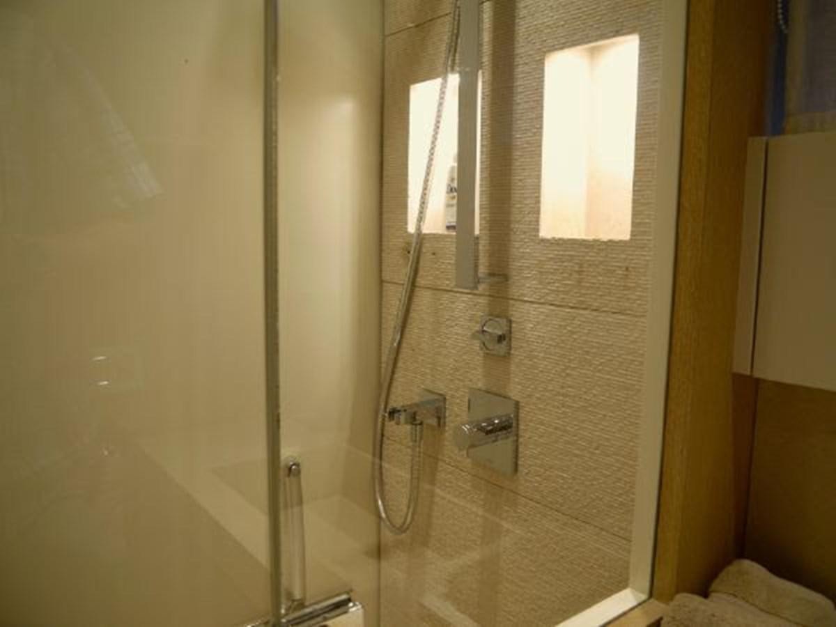 a shower unit with a glass door aboard ASTONISH Yacht for Sale