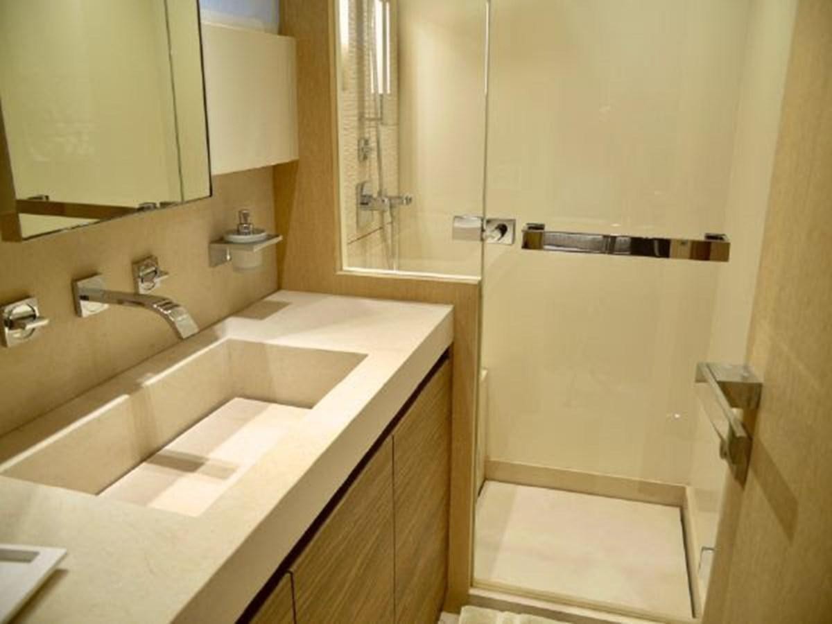 a bathroom with a sink and a mirror aboard ASTONISH Yacht for Sale