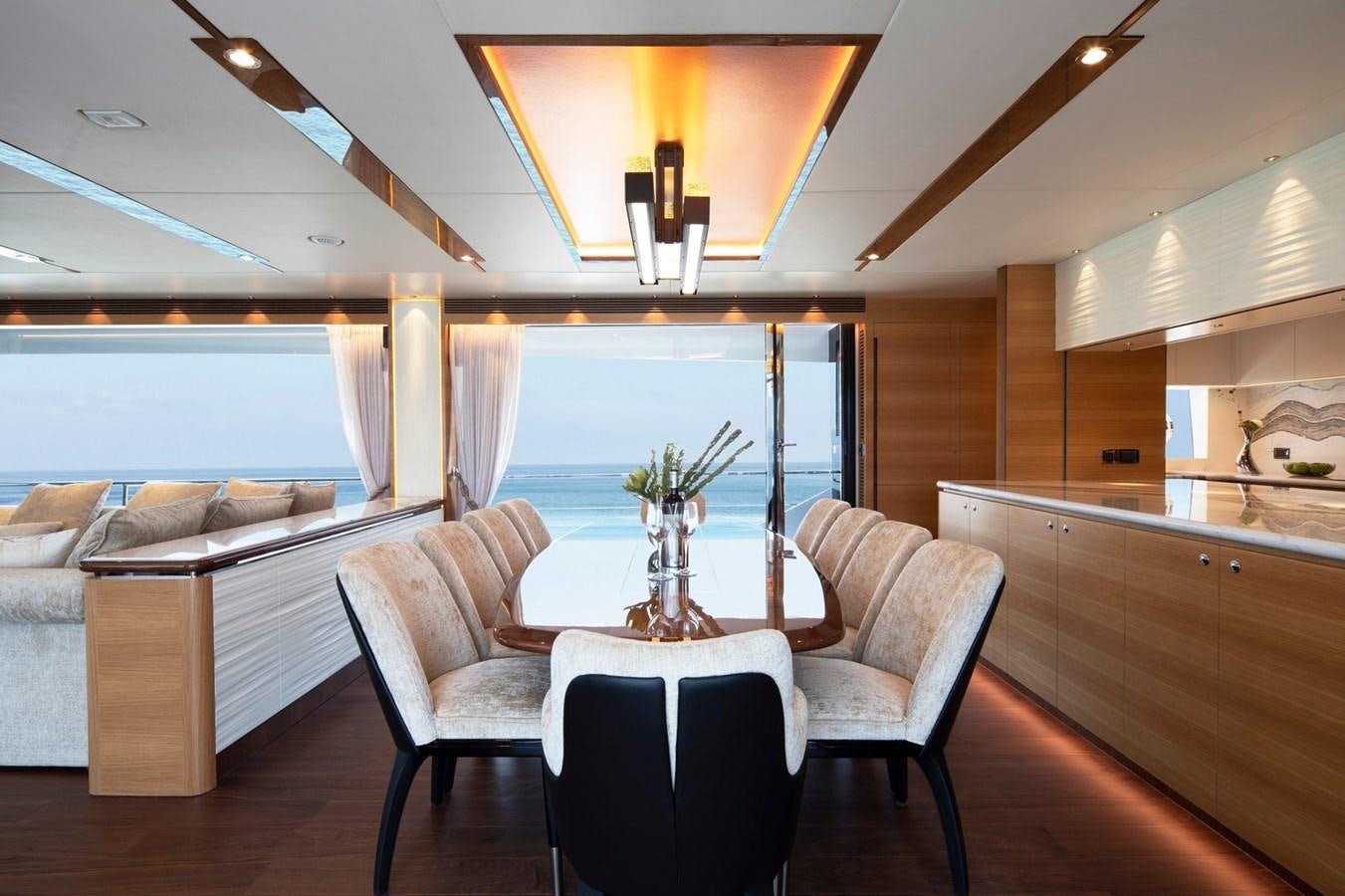 a dining room with a large window aboard FD92 (NEW BOAT SPEC)  Yacht for Sale