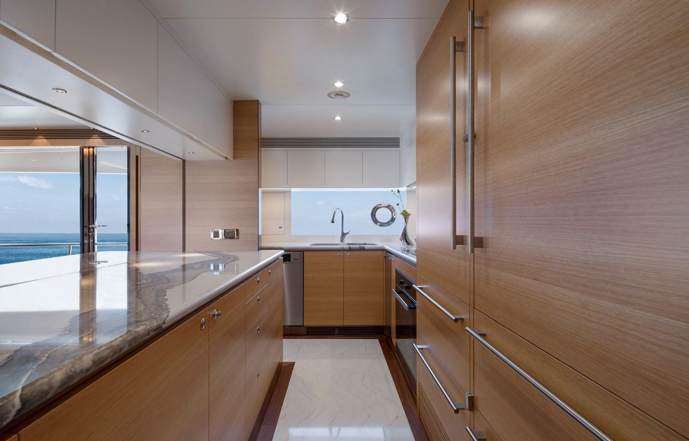 a kitchen with wooden cabinets aboard FD92 (NEW BOAT SPEC)  Yacht for Sale